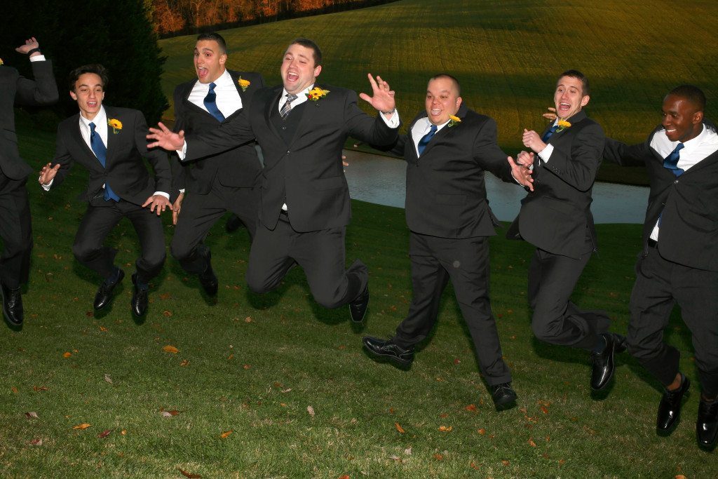 Groomsmen jump at Kerry & Jacob's Fall Outdoor Wedding