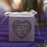 Wedding favor box with ribbon on top and heart display in front with text "thank you for sharing our special day"