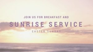 A serene image of a sunrise over the ocean with text overlay that reads, "Join us for breakfast and Sunrise Service Easter Sunday." The sky is a soft blend of pastel colors and the ocean waves are gently crashing in the foreground.