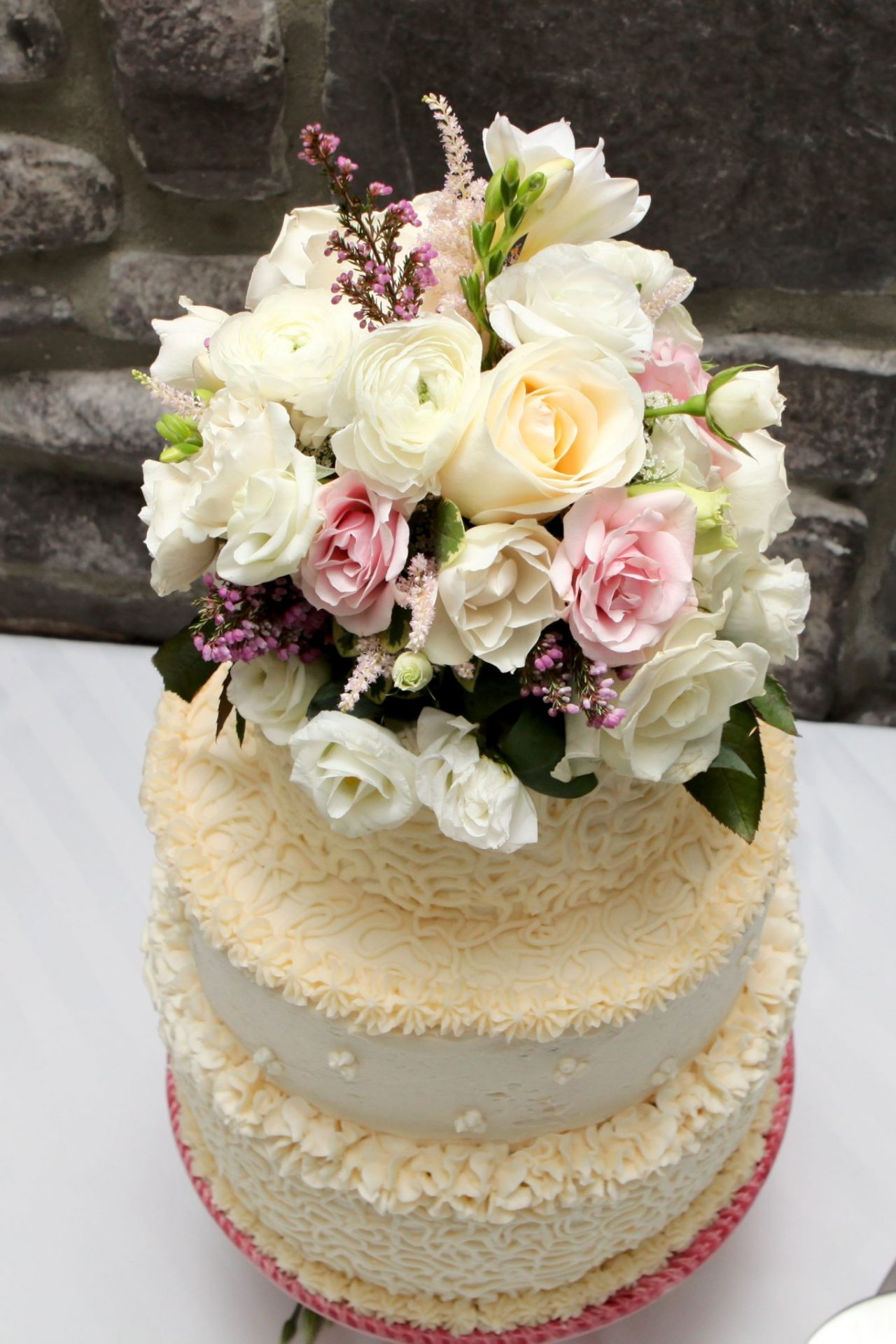 wedding cake topped with flowers