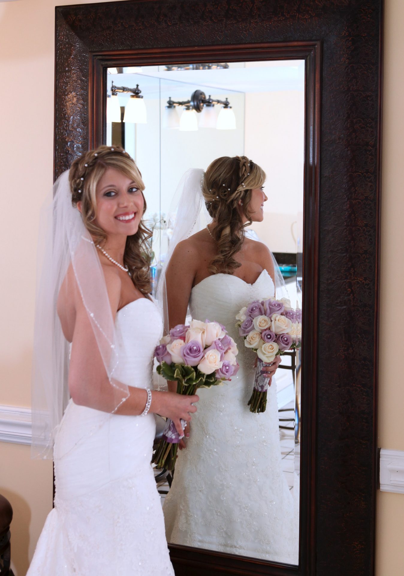 bride in front of mirror in bride's room