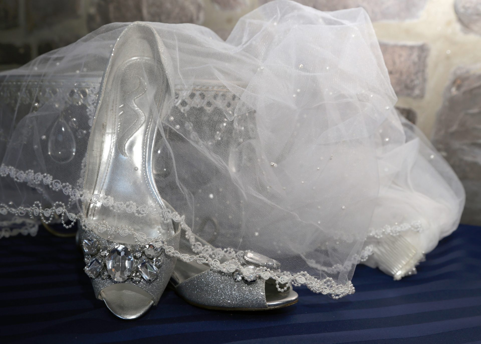 Kristin's veil and wedding shoes before her outdoor wedding