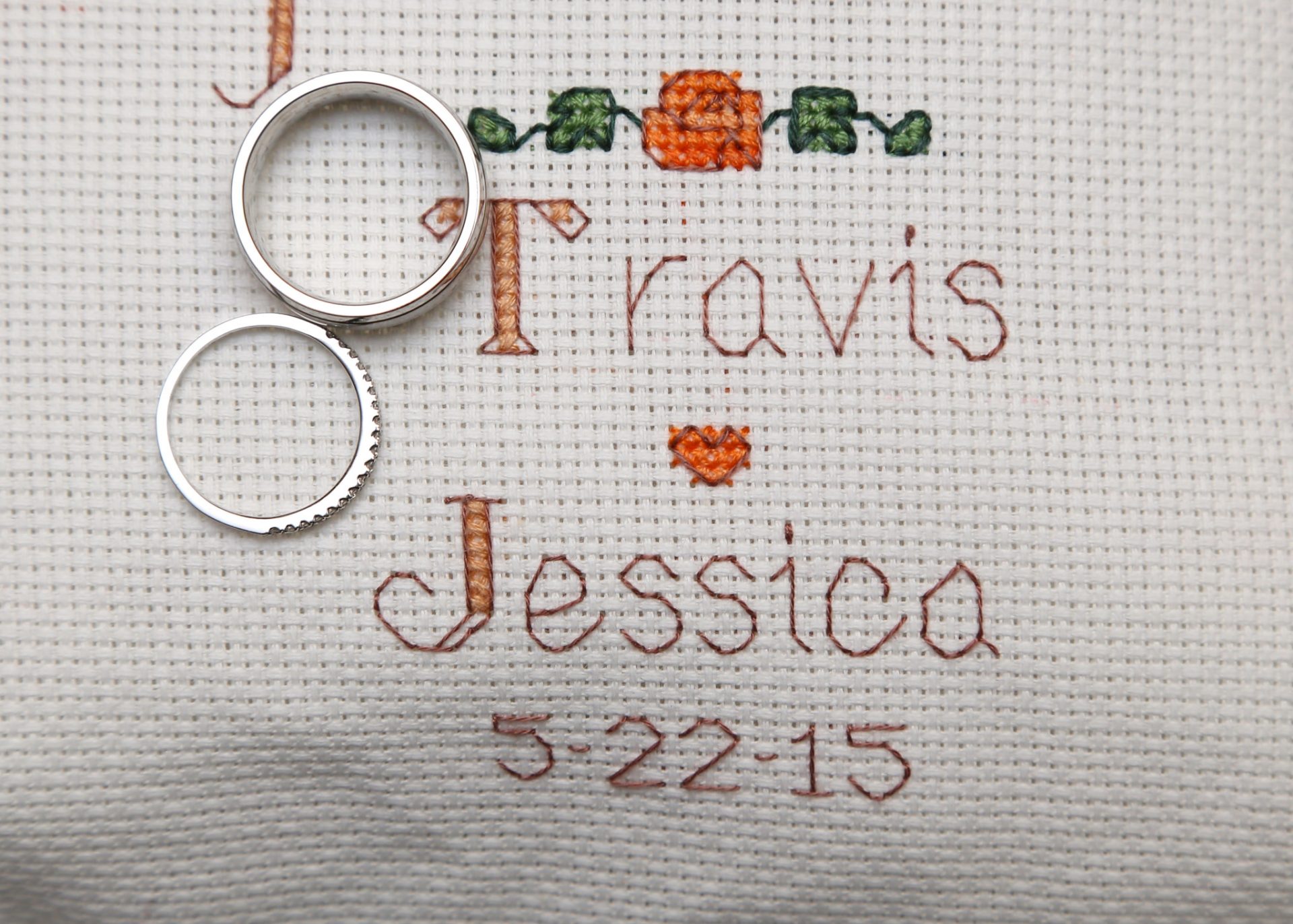 hand made wedding gift of cross stitched pillow with name of bride and groom and date of wedding