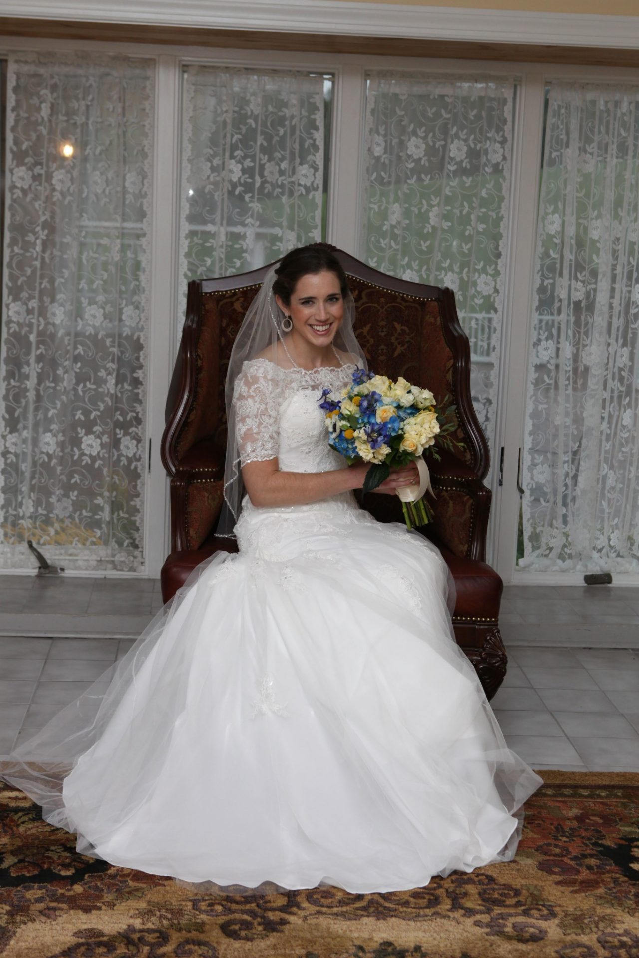 Bride posing in large bride's room before her wedding in Maryland