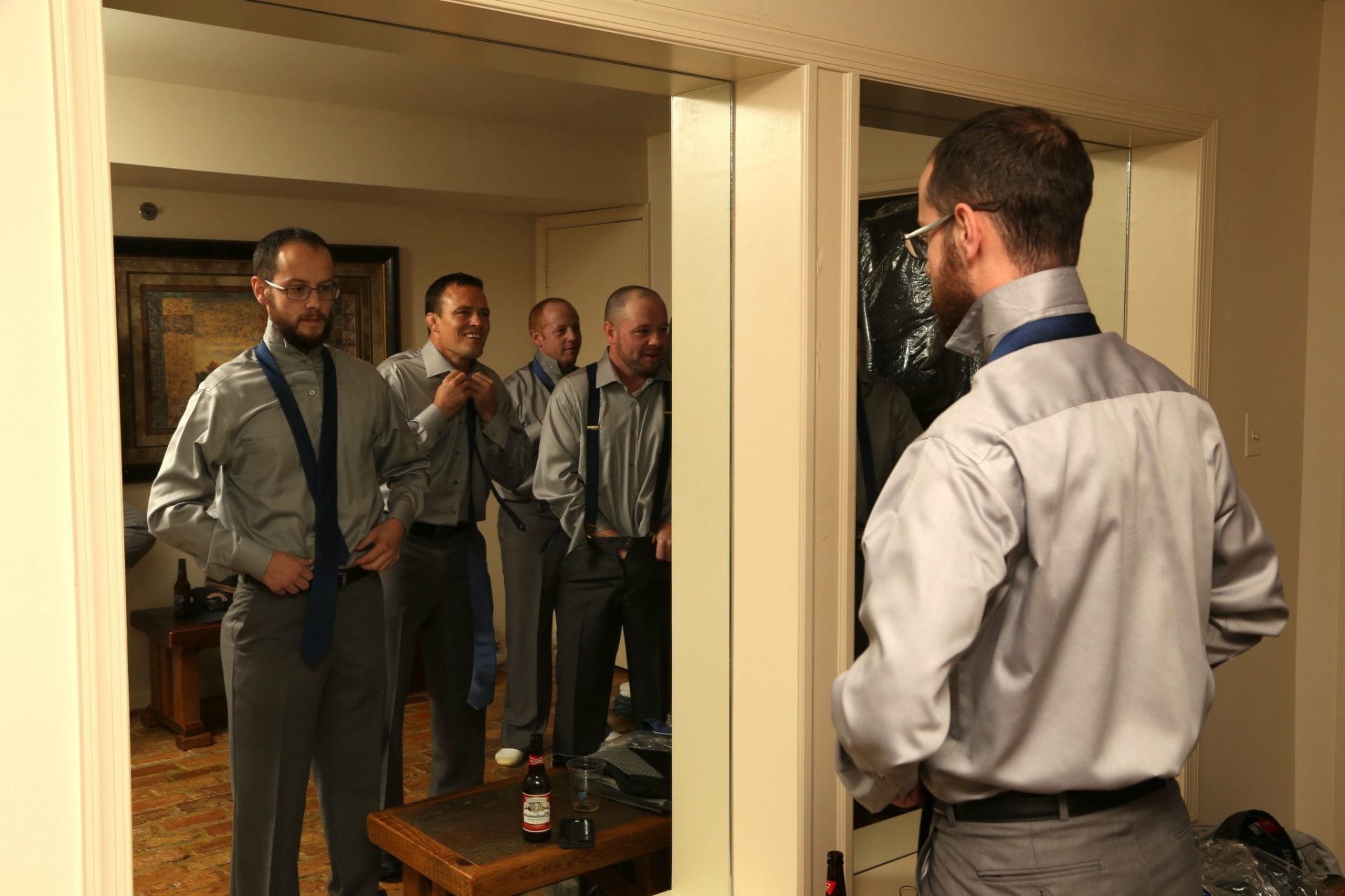 Large mirrors make wedding preparations easy for groom and groom's men