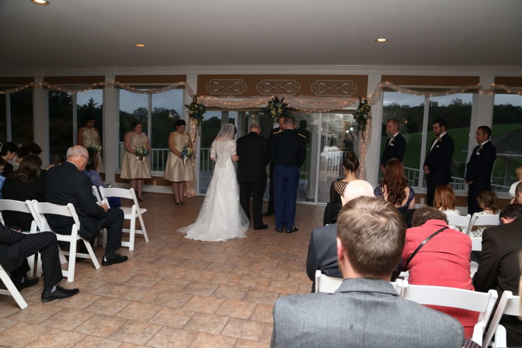 Due to weather, the couple held their wedding ceremony inside with a gorgeous view.