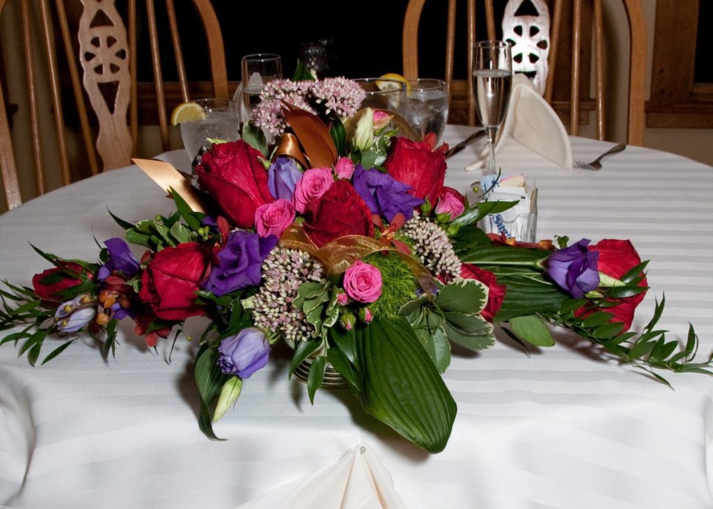 Wedding flower centerpiece on display at head table