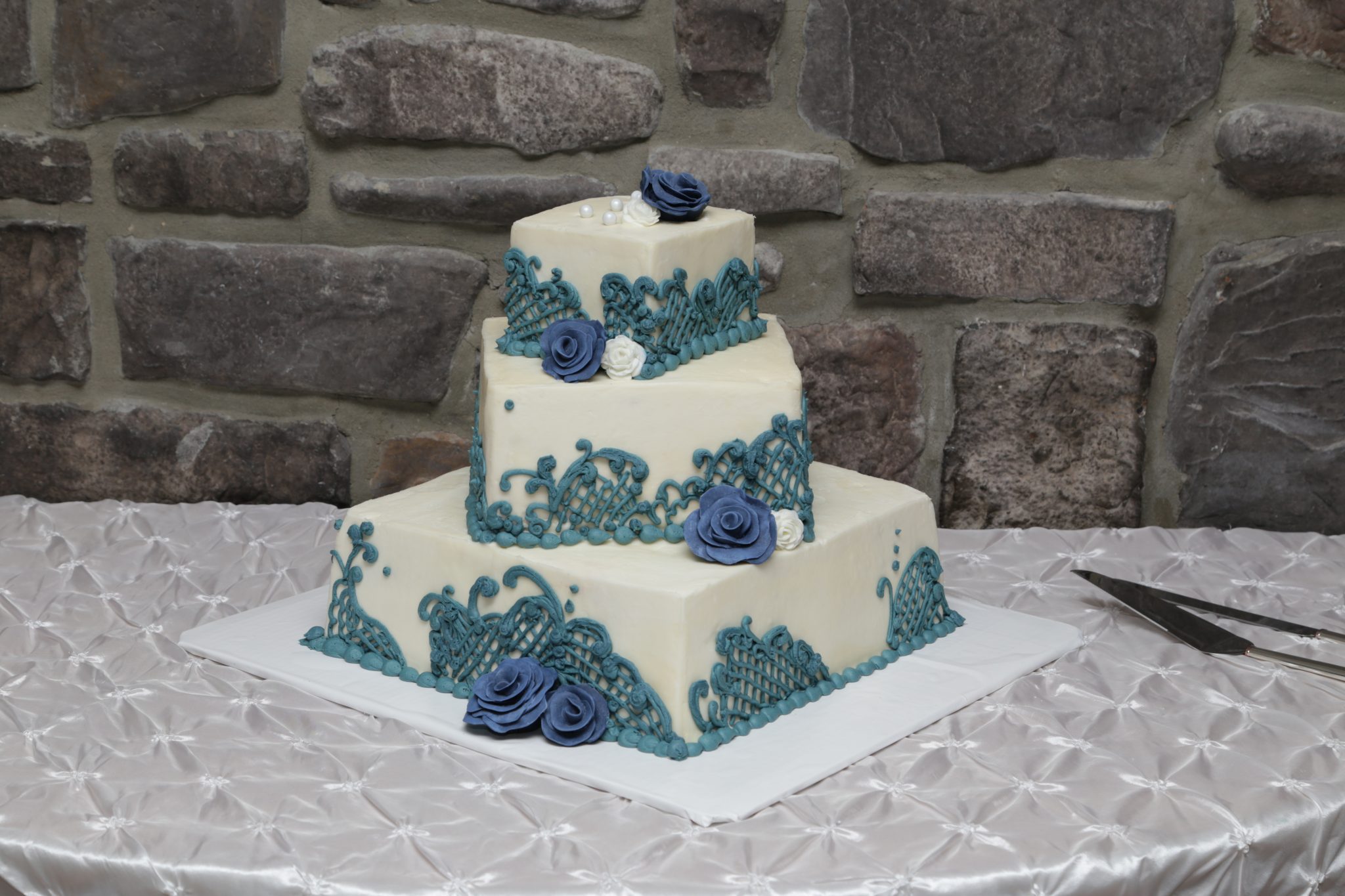 Country wedding cake with cream and blue icing