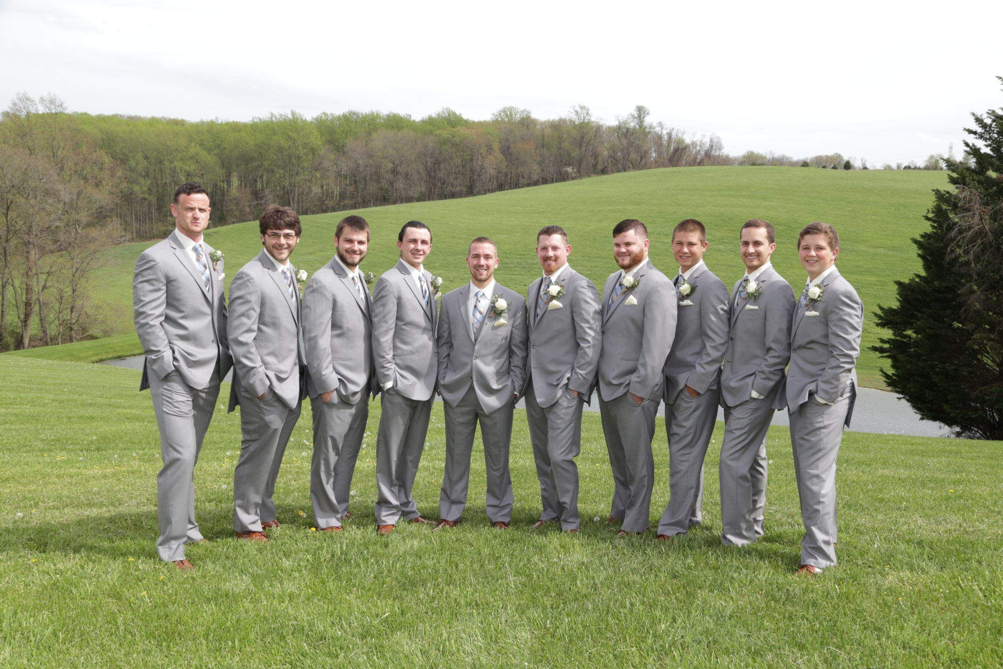 Groomsmen posed for photos on back lawn