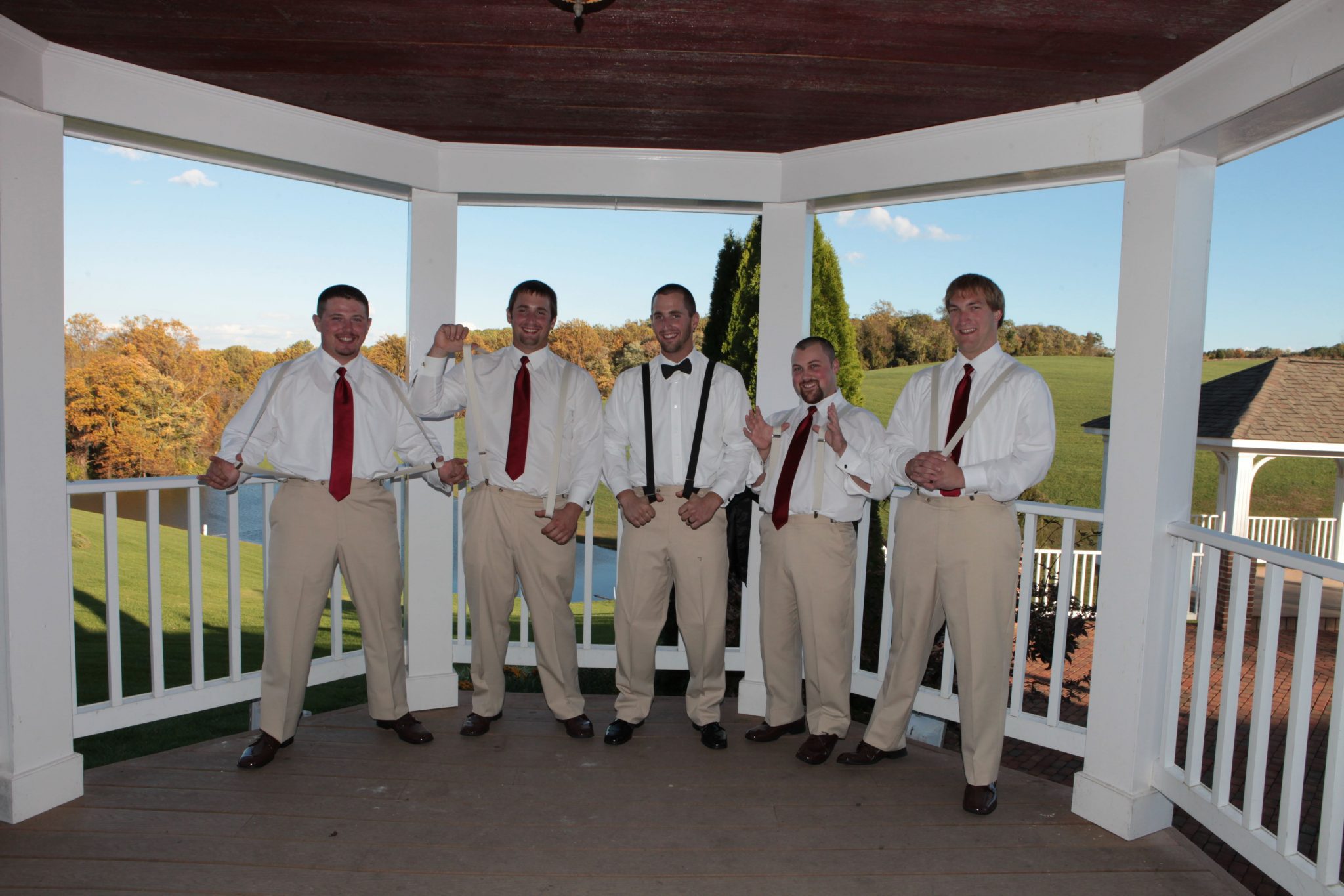 Groomsmen pose on the gazebo at Morningside Inn wedding venue in Maryland