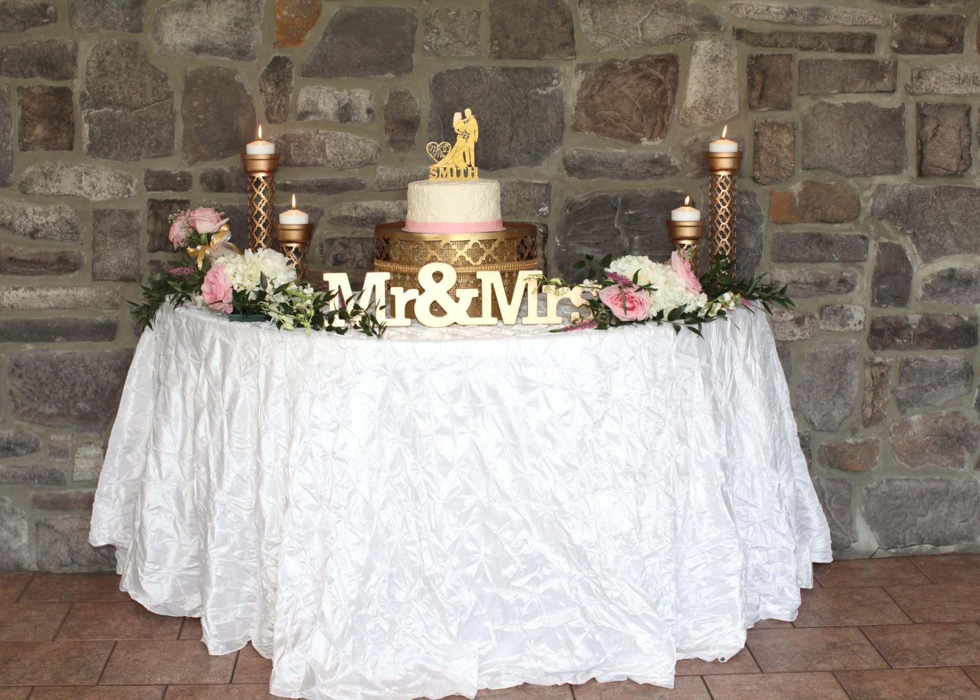Cake table for tea party themed wedding