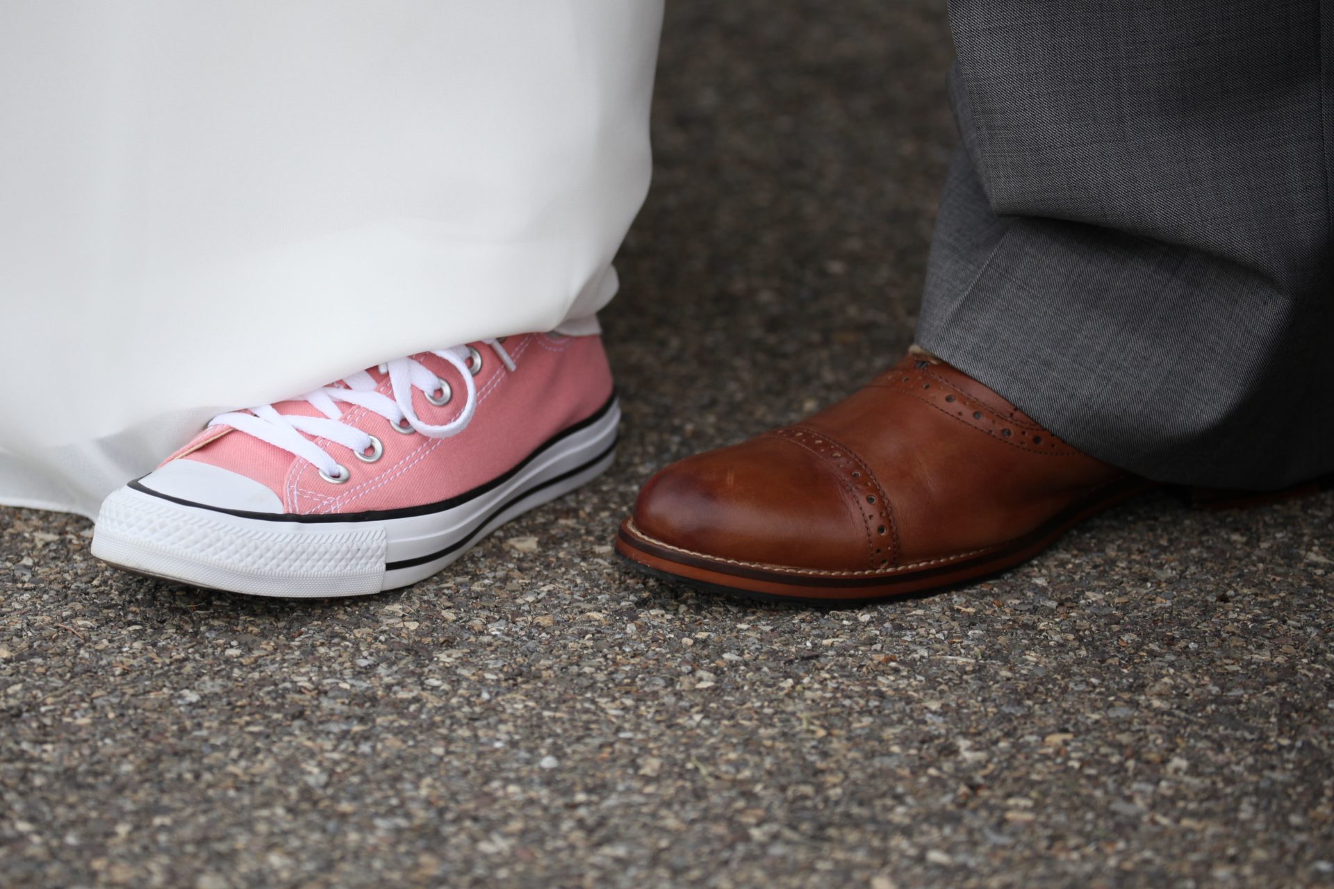 Bride pink sneakers at wedding