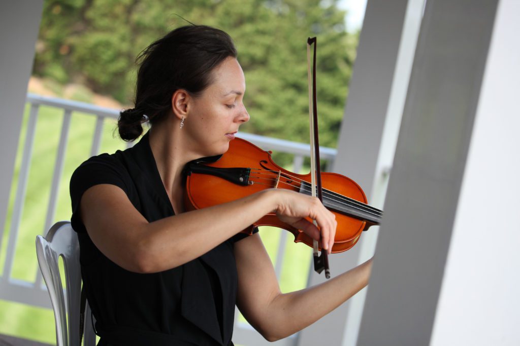 Violin plays before wedding ceremony