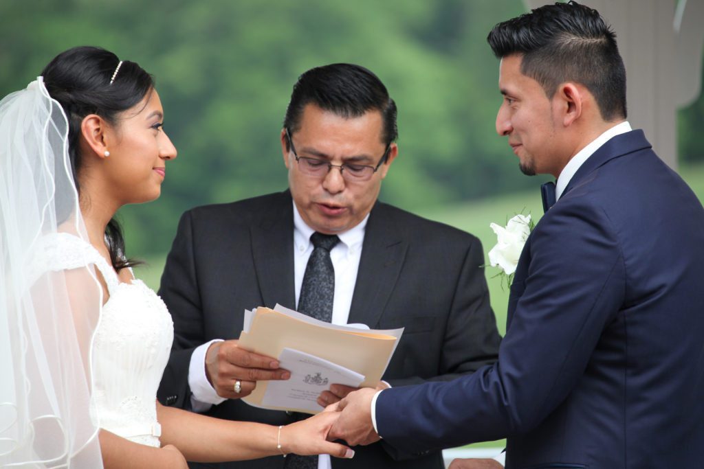 Bride and groom saying vows on outdoor pavilion at Morningside Inn wedding venue