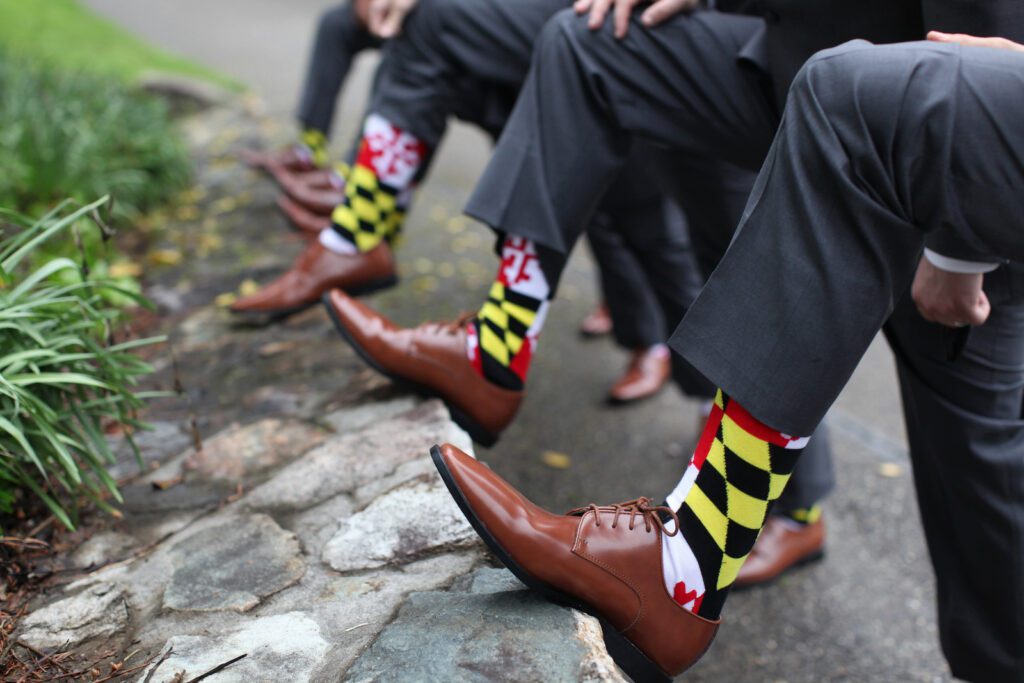groomsmen showing off socks
