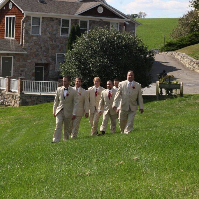 Groomsmen pose outside of groom's room Outside of groom's room there are plenty of photo opertunities